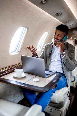 Business traveler in a flight enjoying VIP benefits